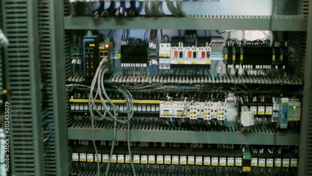 Poster wires in a box of distribution of an electricity. clip. electrical panel with fuses and contactors. 
