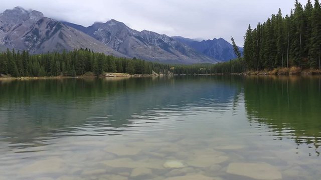 Johnson Lake and mountain reflection on johnson lake in the Canadian Rockies Banff Alberta Canada