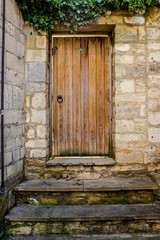 Fototapeta na wymiar Old Door of Stone Cottage House