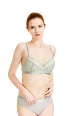 Obraz premium Attractive slim woman in grey matching underwear