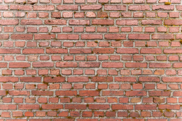 Weathered red brick wall