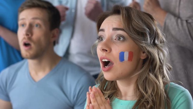 French supporters celebrating victory of national team, watching football match