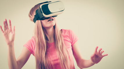 Girl wearing virtual reality goggles.