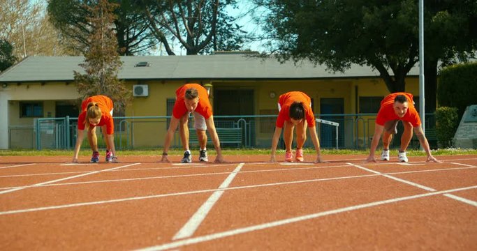 Track runners at starting line. shot in slow motion