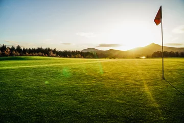 Foto op Canvas Golfbaan met zon © James Allen