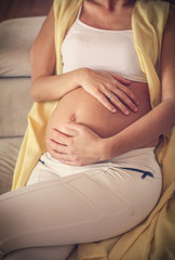 Close up image of beautiful woman and her belly.