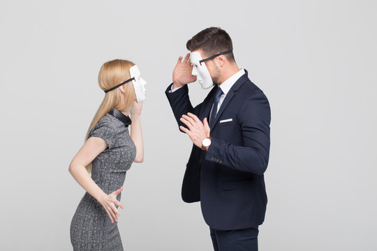 Stylish woman and man in mask fighting