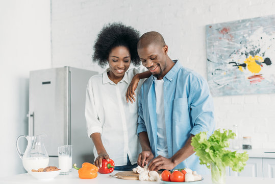 Portrait Of African American Cooking Breakfast Together In Kitchen At Home