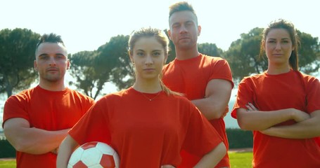 slow motion shot of mixed soccer team - Powered by Adobe