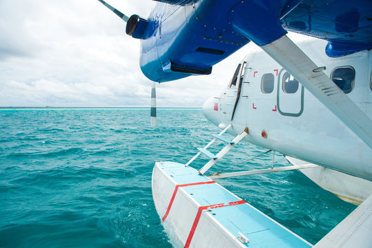 Sea plane at tropical beach resort