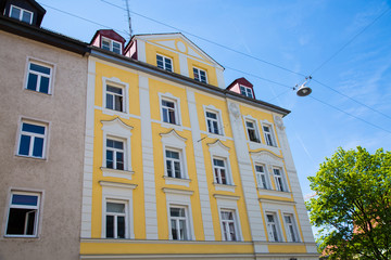 Fototapeta na wymiar Residential houses in Munich, beautiful residential area, blue sky