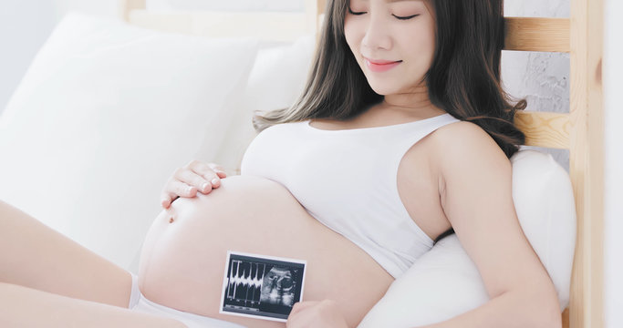 woman holding baby ultrasound