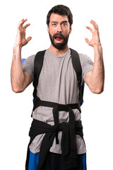 Fototapeta premium Frustrated handsome backpacker on white background