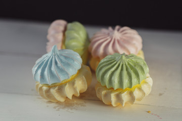 meringue cake, meringue on a white table assorted