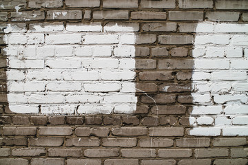 Old realistic dirty brick wall made of white brick. White uneven brickwork. Part of wall is painted white. Two rectangles for mock close-up.
