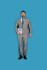 top view of businessman with newspaper isolated on blue background