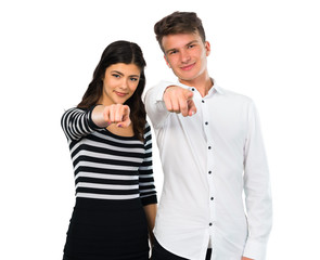 Young couple points finger at you on isolated white background
