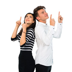 Young couple pointing with the index finger a great idea on isolated white background