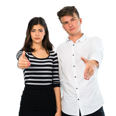 Young couple handshaking after good deal on isolated white background