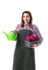 woman professional gardener or florist in apron holding flowers in a pot and gardening tools  isolated on white background. Copy space