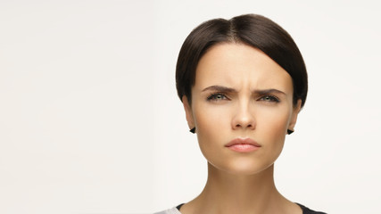 Fototapeta premium Emotional portrait of a beautiful girl. Short haircut.