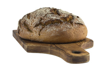 homemade bread on a wooden board isolated on a white background. 