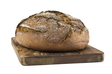 homemade bread on a wooden board isolated on a white background. 