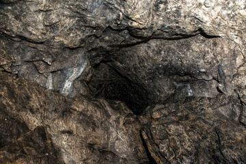 View inside a deep cave. The dark abyss.