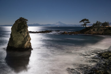 Night seascape of Sagami Bay and Mt.Fuji seen from Tateishi park view point. Tateishi Park is located west side of Miura Peninsula. It is one of the 50 views of Kanagawa