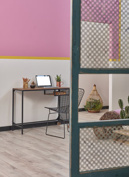 home office working table with laptop. beautiful interior decor black chair and paravane style.