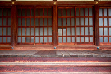 Sliding wood and glass doors at the main entrance to a Japanese Temple