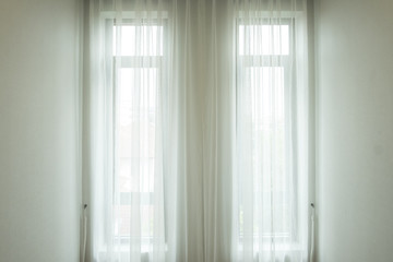 Fototapeta na wymiar Background and texture of white drape at the window.
