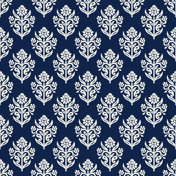 Indigo dye woodblock printed seamless ethnic floral all over pattern. Traditional oriental ornament of India, lily flowers of Kashmir, ecru on navy blue background. Textile design.