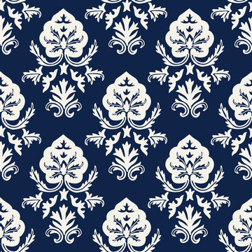 Indigo dye woodblock printed seamless ethnic damask pattern. Traditional oriental ornament of  Kashmir India, stylized acanthus leaves, ecru on navy blue background. Textile design.