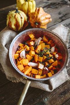 Diced pumpkin, garlic, rosemary and pumpkin seed in casserole
