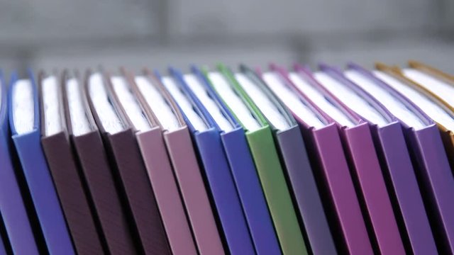 books, notebooks, diaries are on a gray background