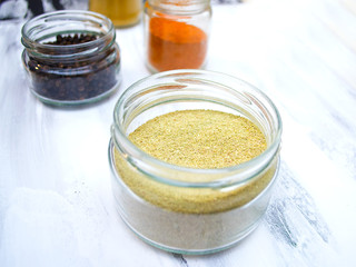 different spices in a jar, top view