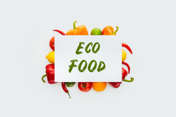 top view of sheet of paper with text Eco Food on vegetables and fruits isolated on white