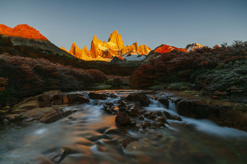 View of Mount Fitz Roy and the river in the National Park of Los Glaciares during sunrise. Autumn in Patagonia, the Argentine side