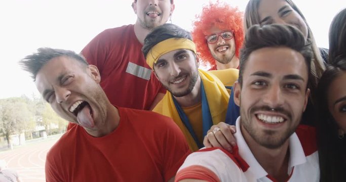 group of fan sport taking selfie. shot in slow motion