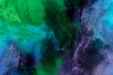 Obraz na płótnie Canvas artistic texture with blue, purple and green paint swirls looks like space