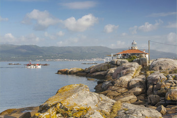 Fototapeta na wymiar Lighthouse on the rocks