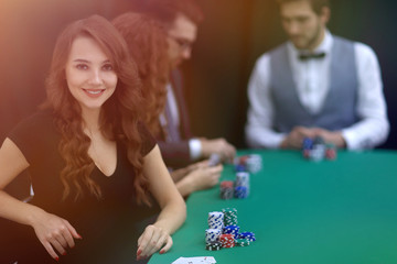modern business woman sitting at craps table in a casino.