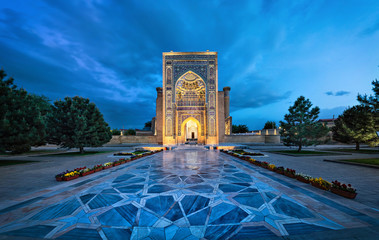 Entrance portal to Gur-e-Amir - a mausoleum of the Asian conqueror Timur (also known as Tamerlane) in Samarkand, Uzbekistan - obrazy, fototapety, plakaty