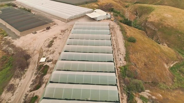 Aerial footage of large greenhouse farm in the Jordan vally in Israel