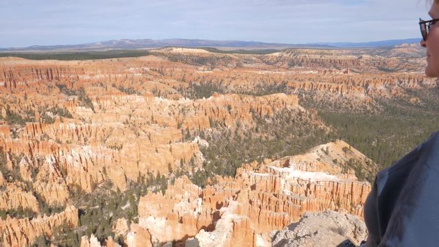 A Woman Admires The Natural Beauty Of The Bryce Canyon