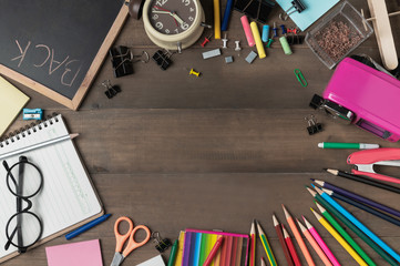 school supplies and stationery on wood