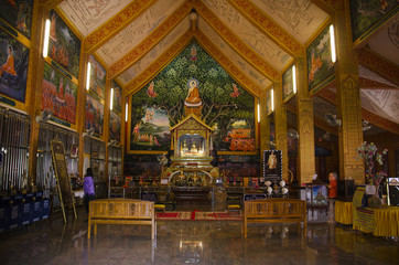 Fototapeta na wymiar Wat Chonprathan Rangsan for thai people visit and praying respect Gilded Buddha image in Tak, Thailand