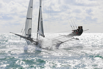 18 foot skiff sailing on a breezy sunny day