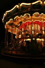 old fashioned carousel in the night lights in Paris